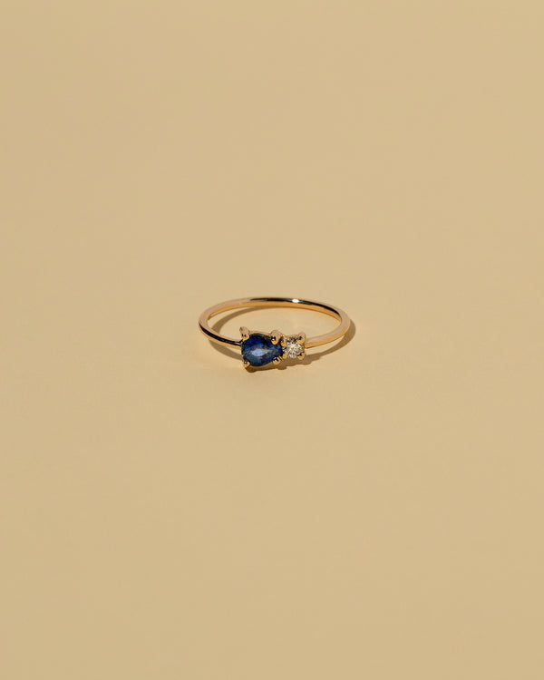 Blue Sapphire Teardrop Ring on light color background.