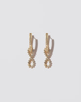 White Diamond Lifecycle Earrings on light color background.