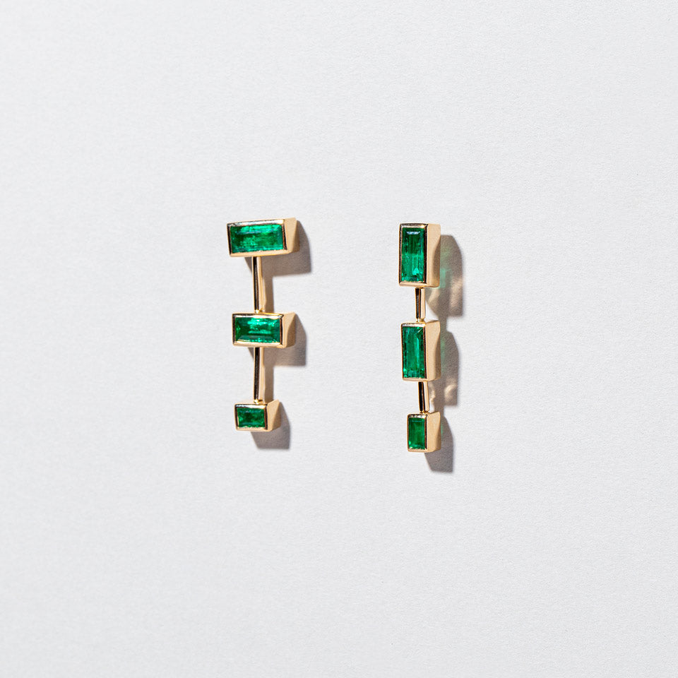 product_details:: The Listening One Earrings on light color background.