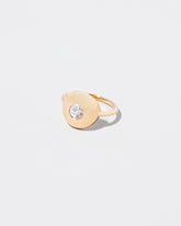 Petite Exposition Ring on light color background.