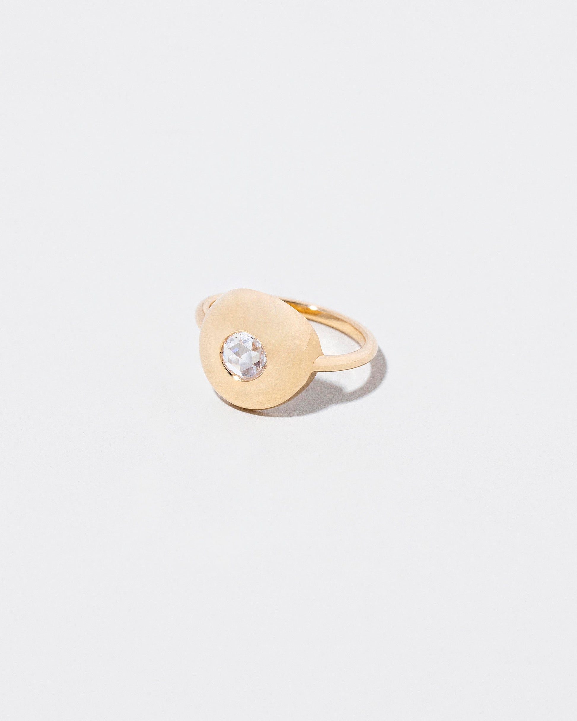 Petite Exposition Ring on light color background.