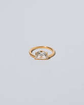 Plié Ring on light color background.