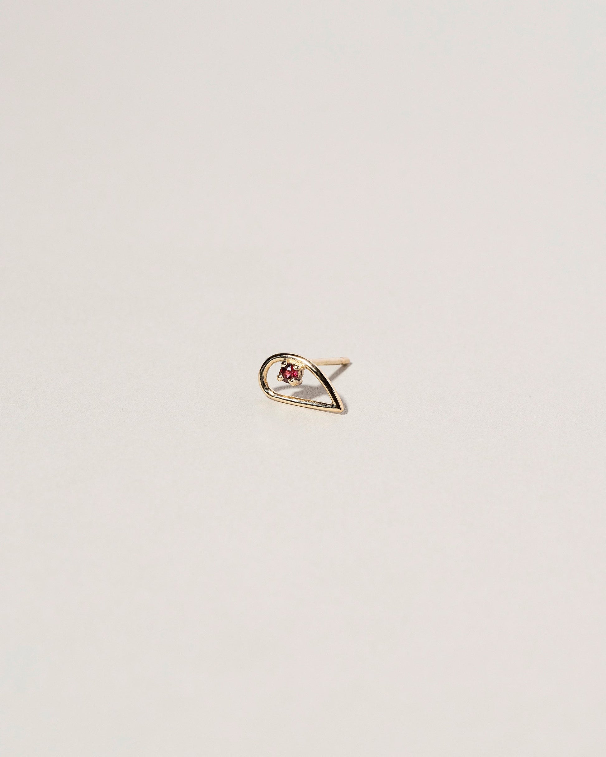 Sun Drop Single Stud on light color background.