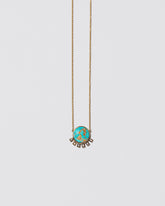 Life-Giver Necklace on light color background.