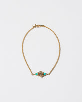 Sunstone & Turquoise Eye Bracelet on light color background.
