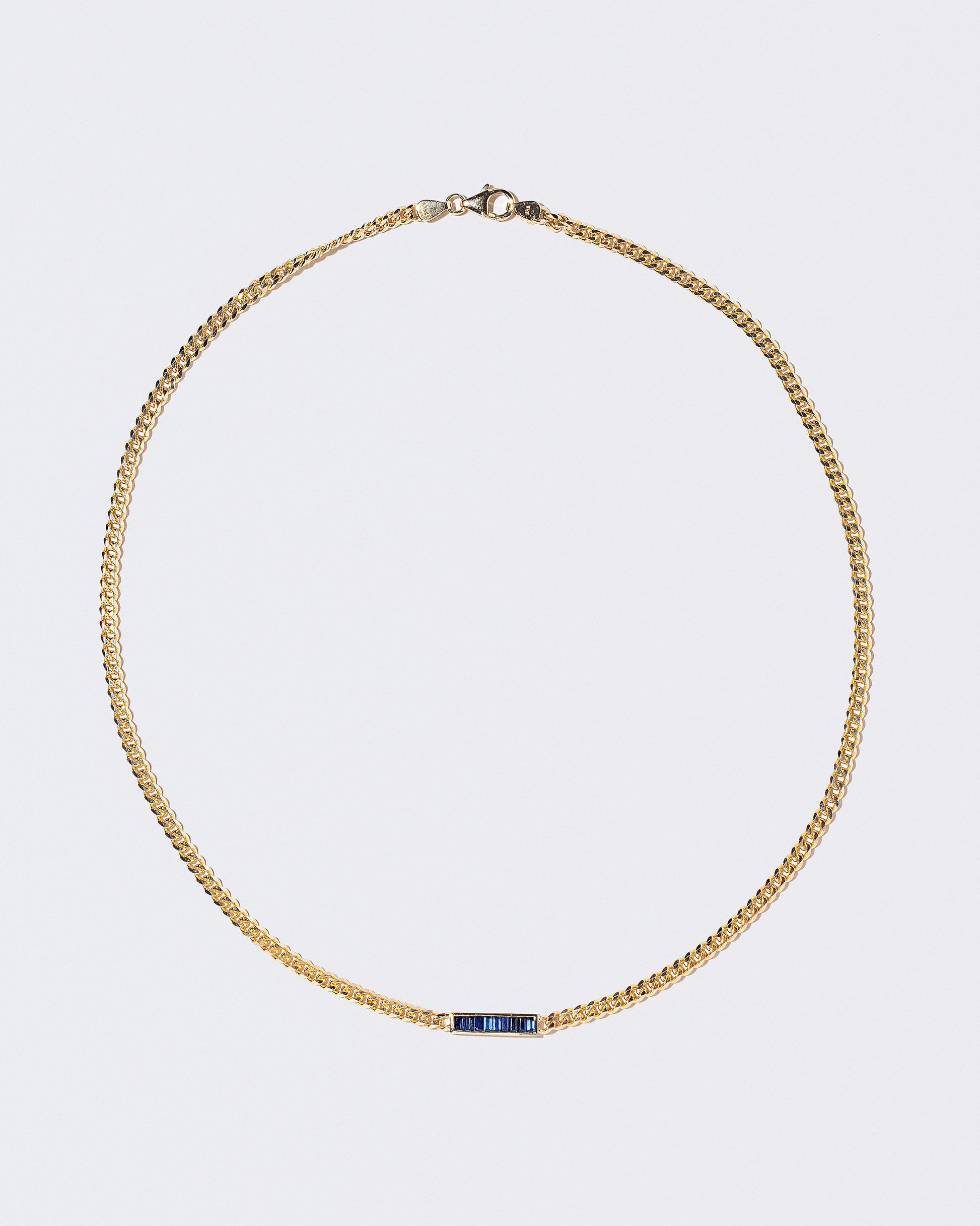 Identity Chain Necklace on light colored background.