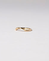  Mini Curve Band - Single Stone on light color background.