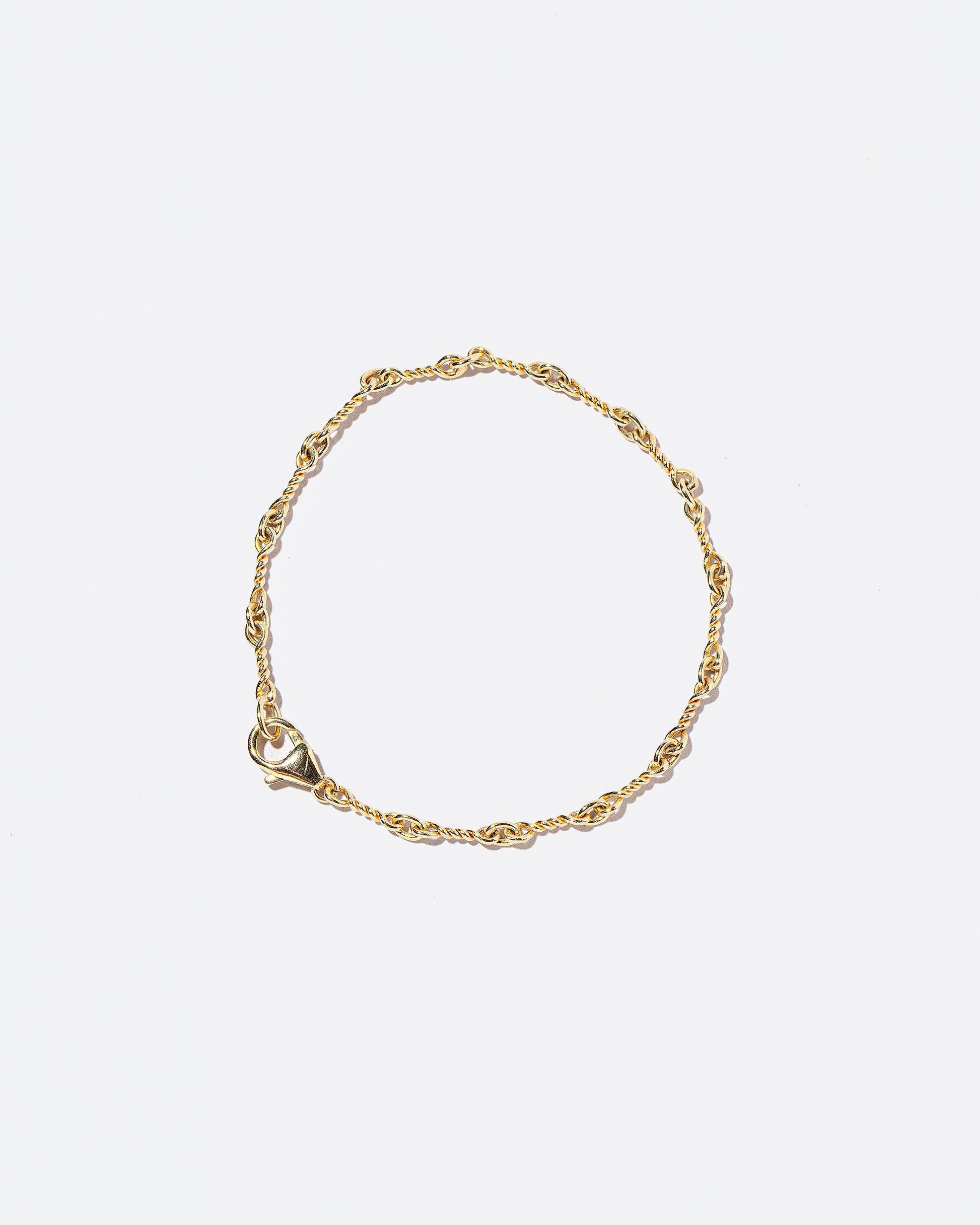 Twisted Chain Bracelet on light color background.