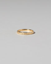 Gold Etched Infinity Pattern Band on light color background.