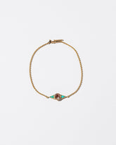 Sunstone & Turquoise Eye Bracelet on light color background.