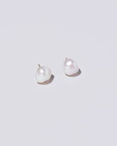 Lagniappe Pearl Stud Earrings on light colored background.