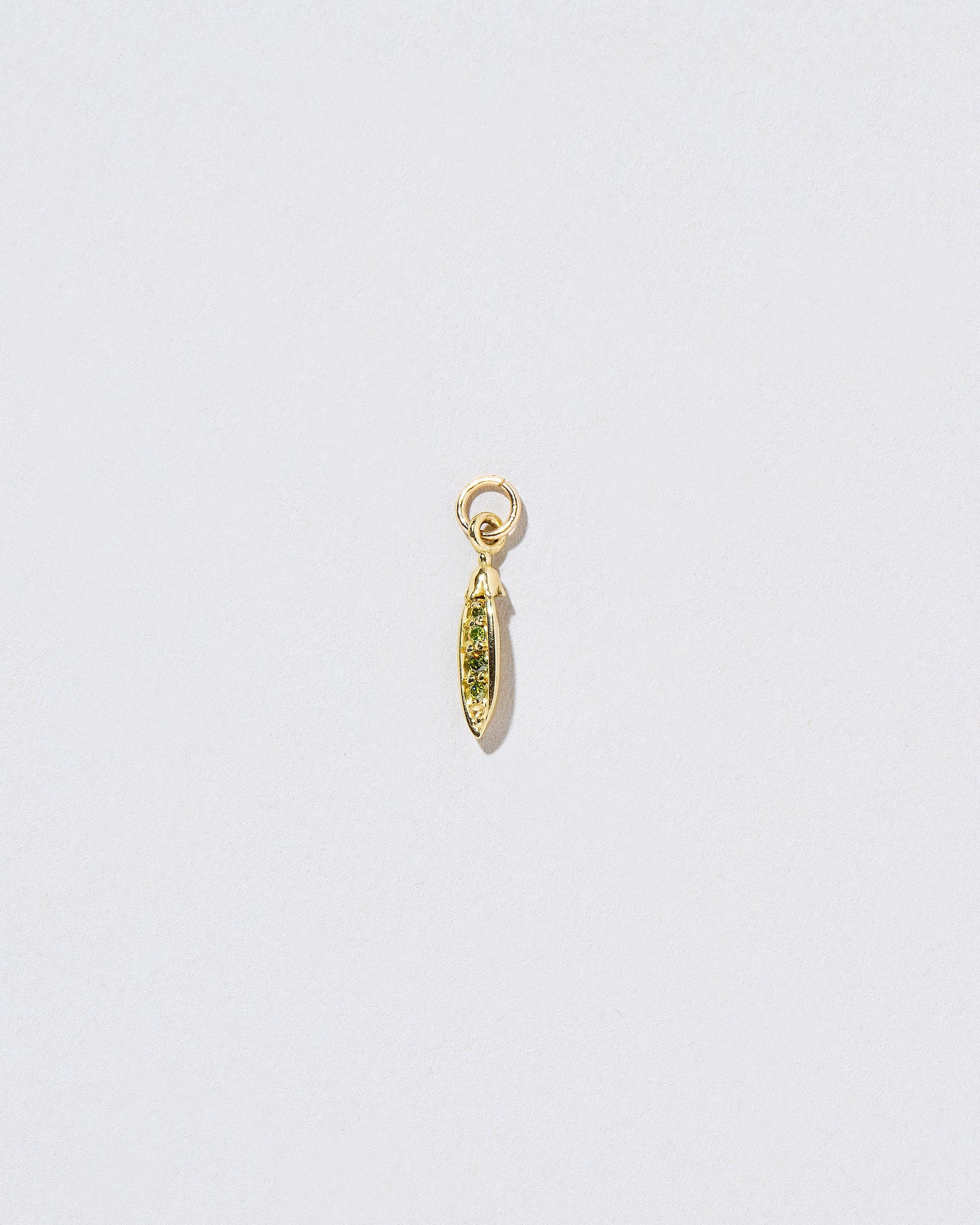 Diamond Snap Pea Charm on light color background.