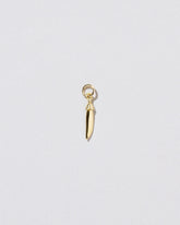 Snap Pea Charm on light colored background.