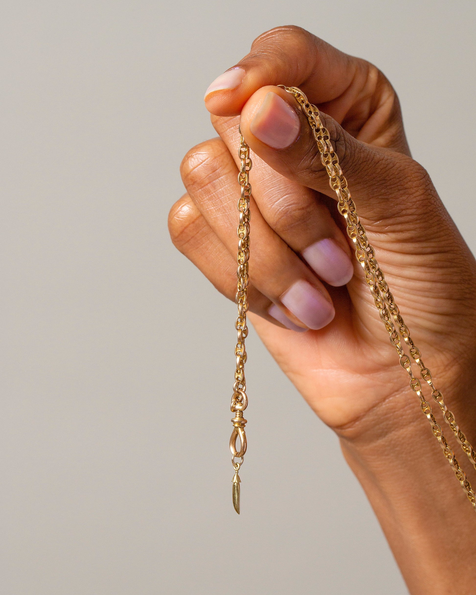 Solid Snap Pea Charm with the Grand Swivel Fob and Segmented Chain Necklace on model.