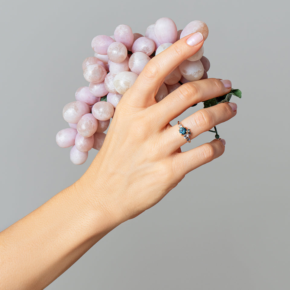 product_details::Luna Ring - Blue Sapphire on light color background.
