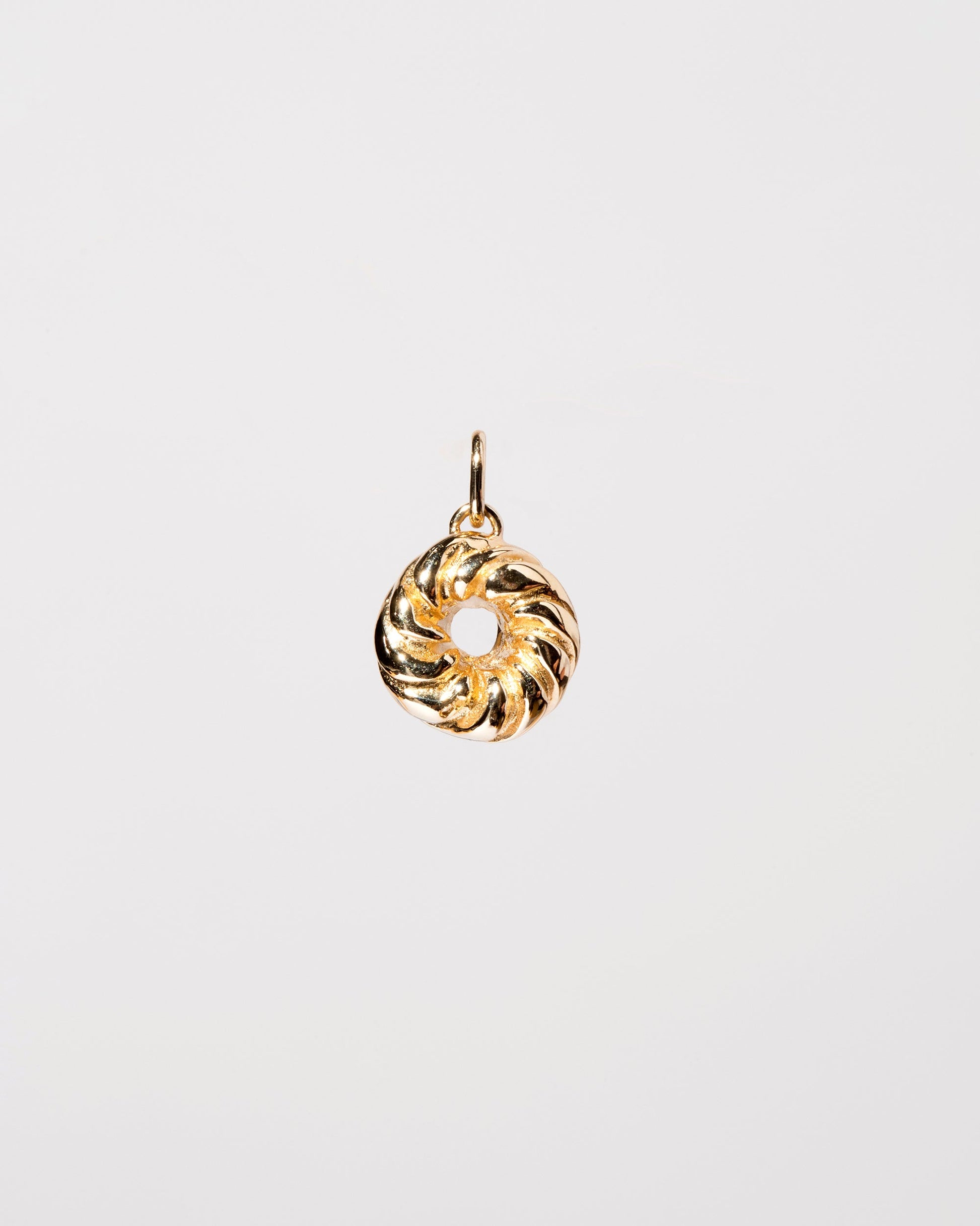 French Cruller Charm on light color background.