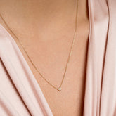 product_details::Half Moon Necklace on model.