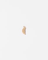  Croissant Charm on light color background.