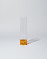 Ichendorf Milano Small Clear/Amber Bamboo Vase on light color background.