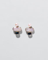 Mantle Earrings on light color background.