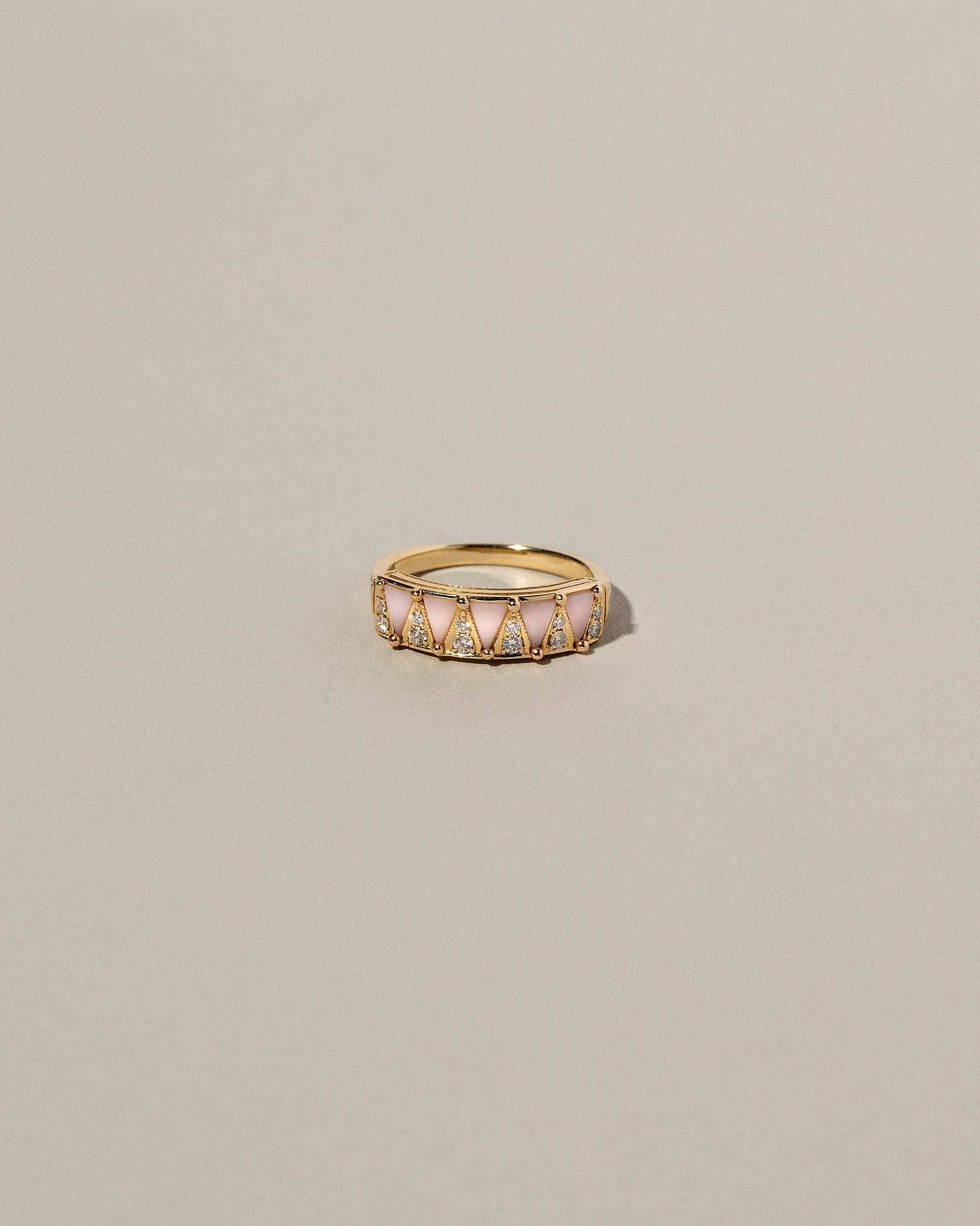 Five Triangle Ring - Pink Opal on light color background.