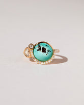 Divine Protection Ring on light color background.