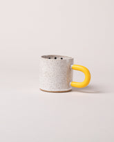 Recreation Center Yellow Dot Mug on light color background