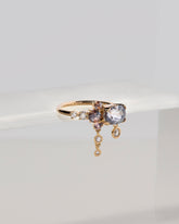 Nivithigala Sapphire Cluster Ring on light color background.