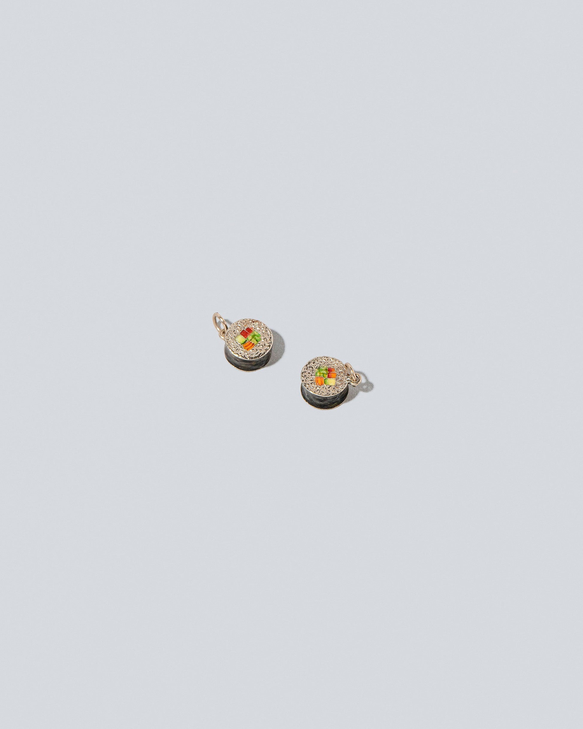 Sushi Charms on light color background.