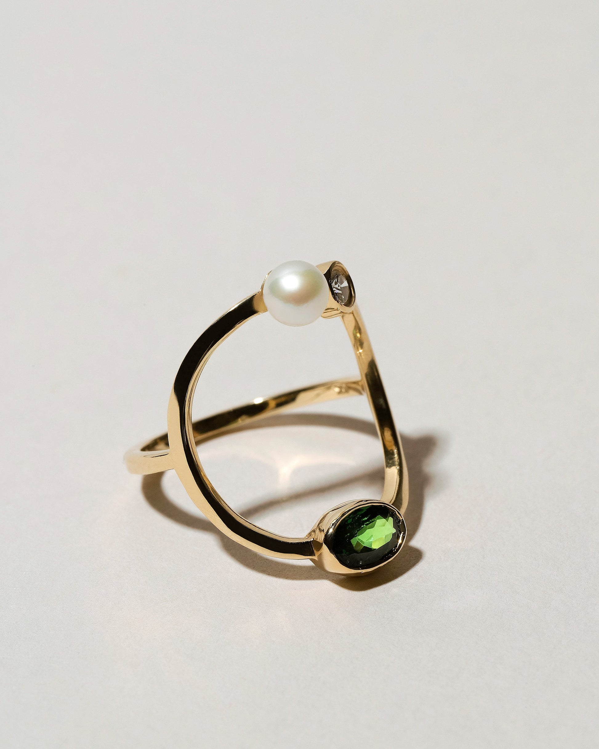 Trilogy Ring - Tsavorite on light color background.