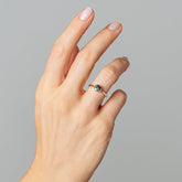 product_details::Bicolor Teal Sapphire Sun & Moon Ring on model.