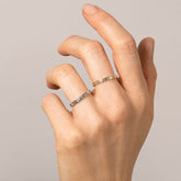product_details::Gold Etched Infinity Pattern Band and Platinum Infinity Pattern Band on model.