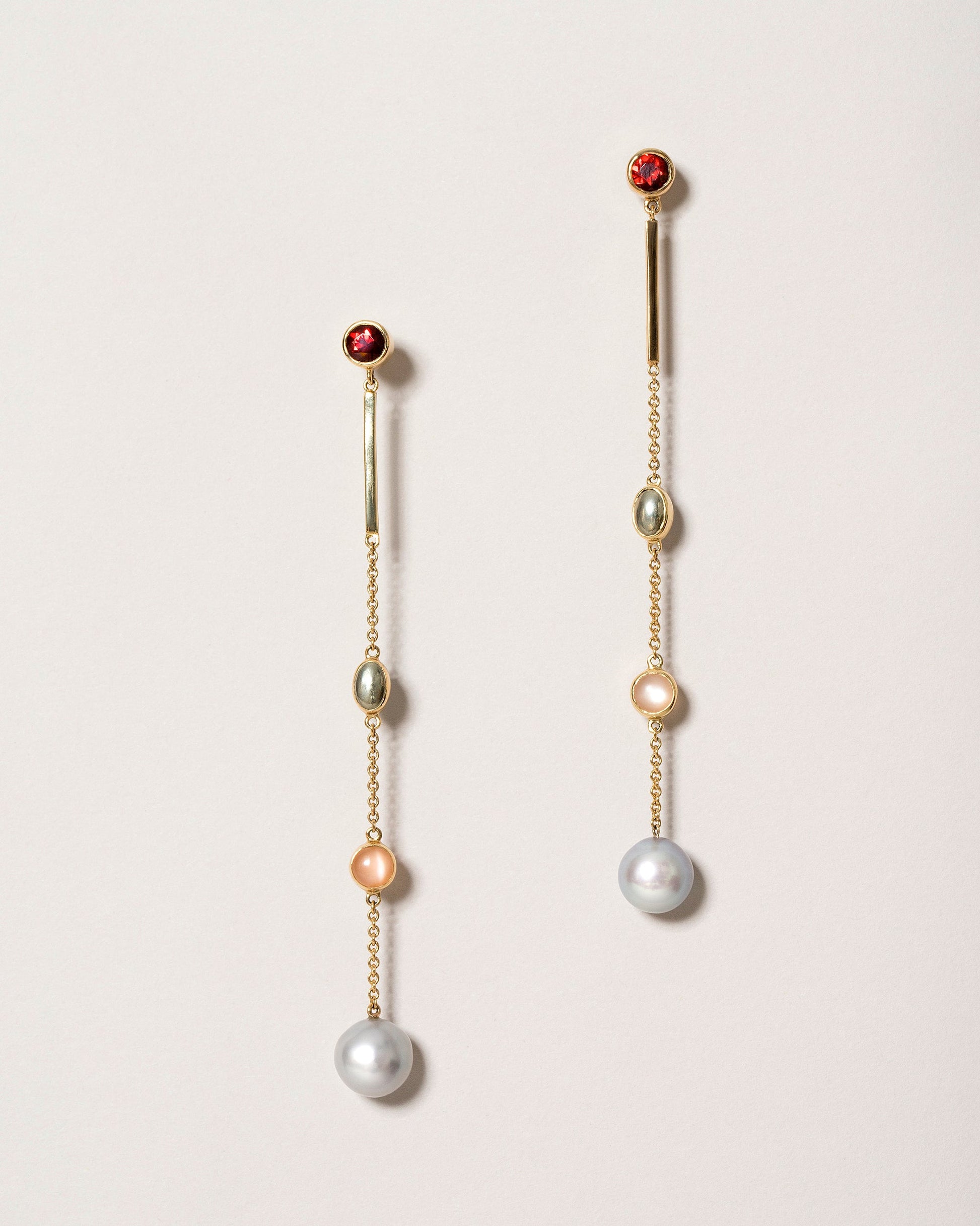 Act 2. Earrings 1 on light color background.