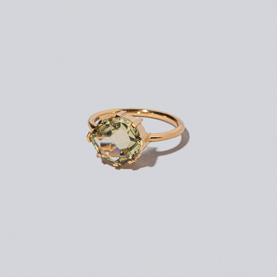 product_details::Closeup details of the Warbler Ring on light color background.