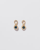 Ouroboros Earring on light color background.
