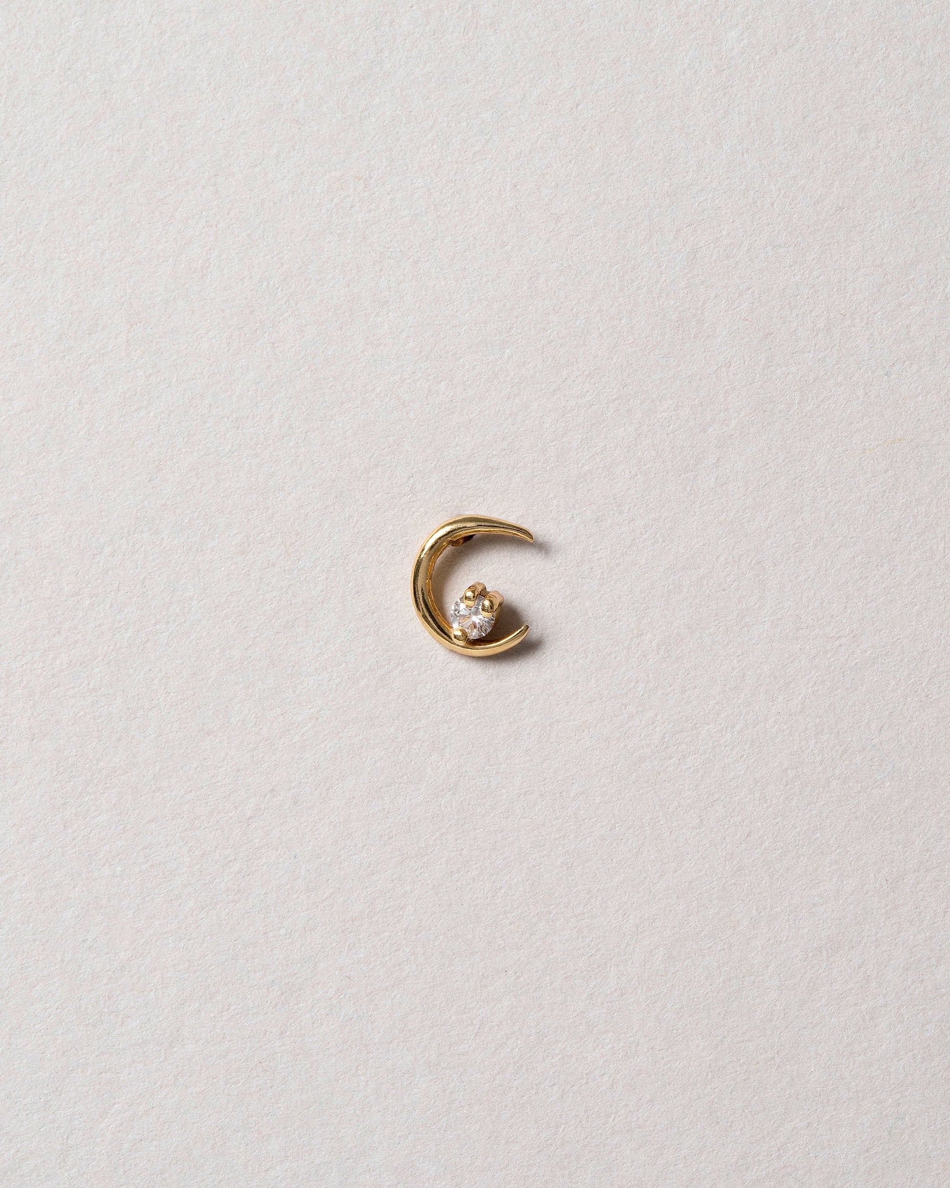 Right White Diamond Moon Ray Stud Earring Single on light color background.