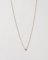 Half Moon Necklace on light color background.