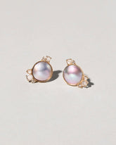 Mabe Pearl Cluster Earrings on light color background.