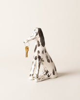 View from the side of the Eleonor Boström Key Dog on light color background.