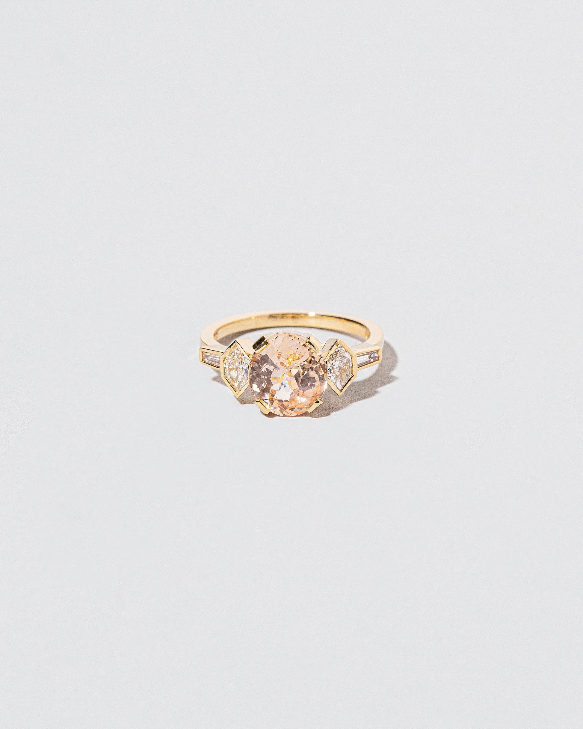 Qualia Ring on light color background.