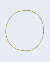 2.4mm Curb Chain Necklace on light color background.