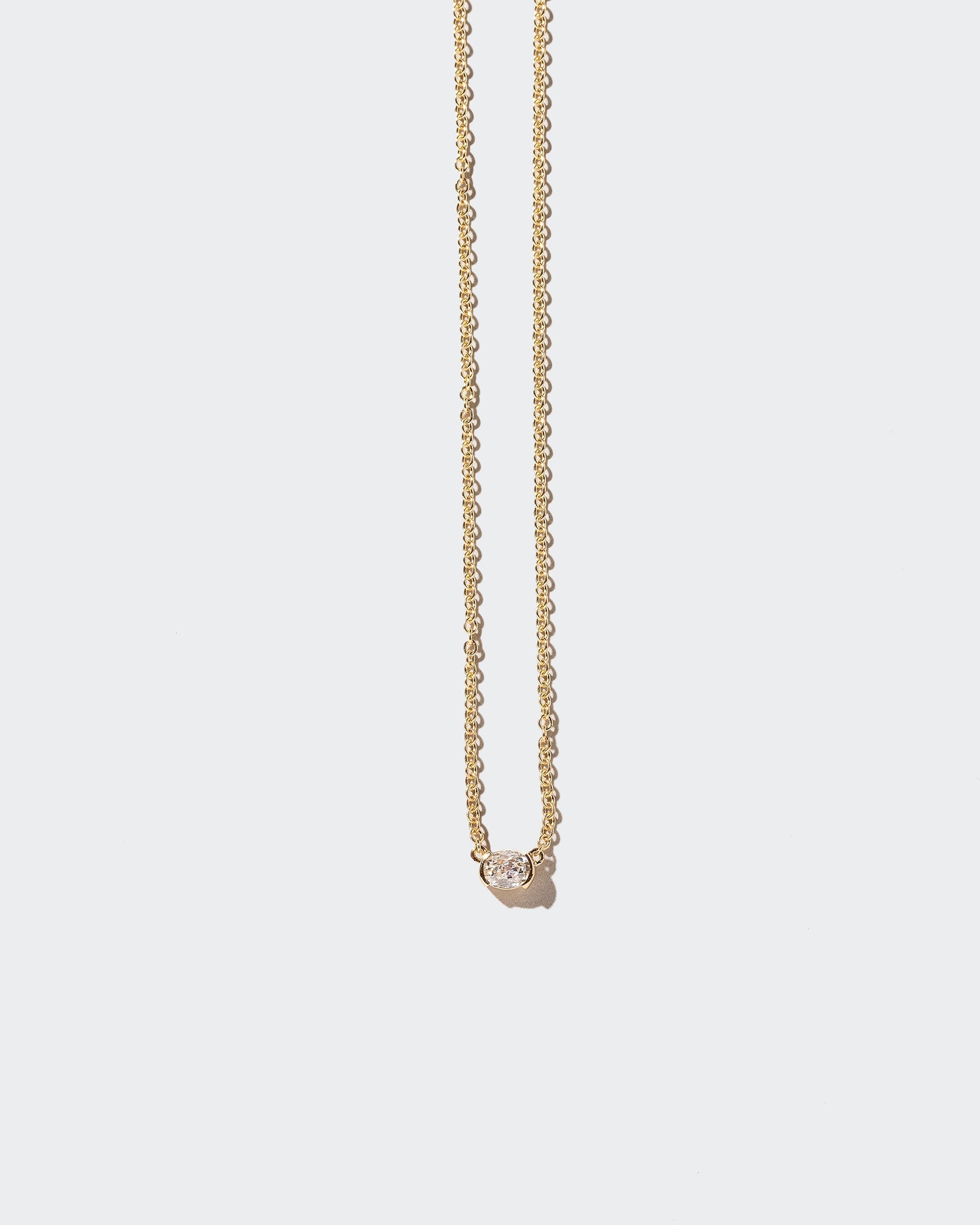 Keel Necklace on light color background.