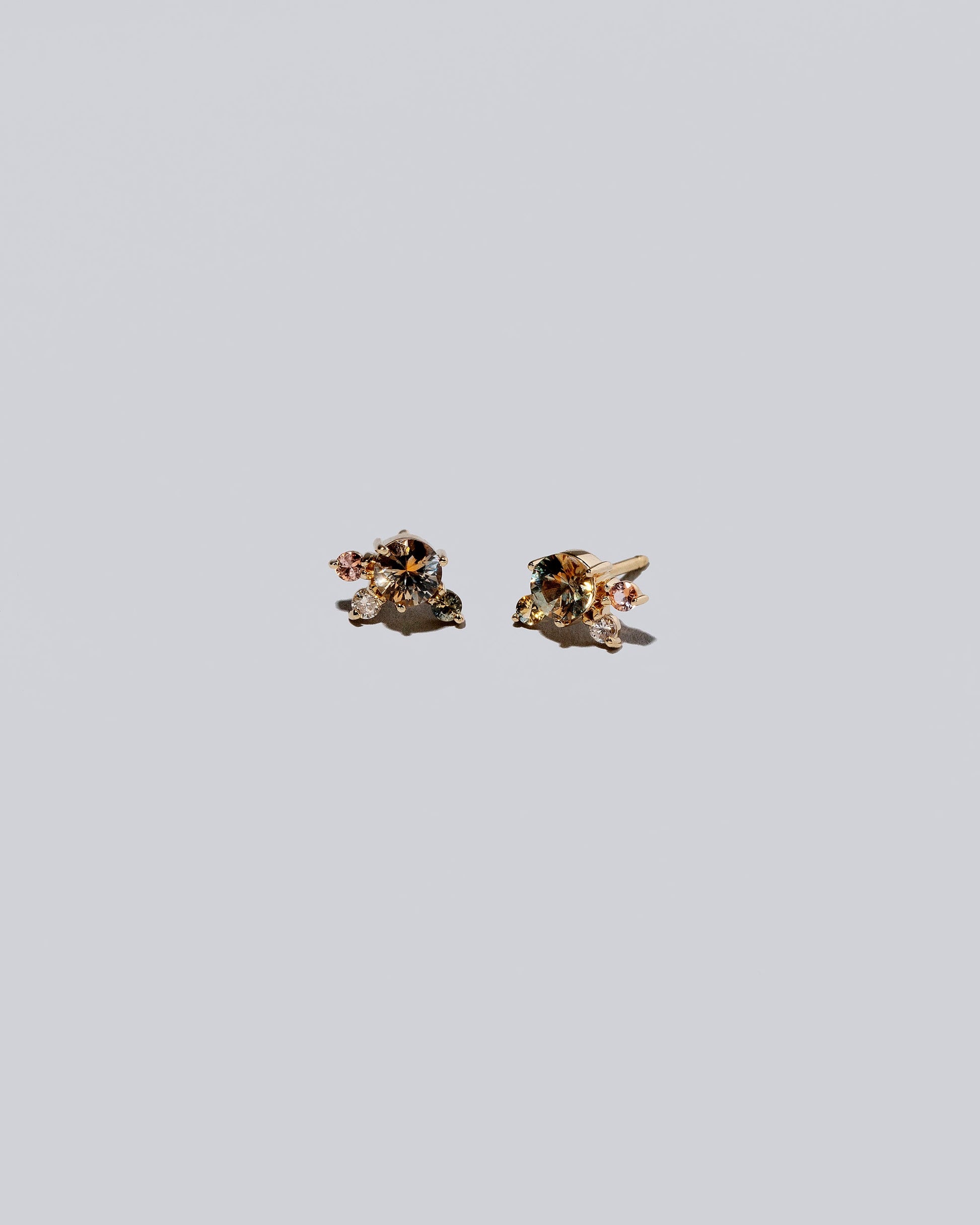 Product photo of Cluster Stud Earrings on a light color background.