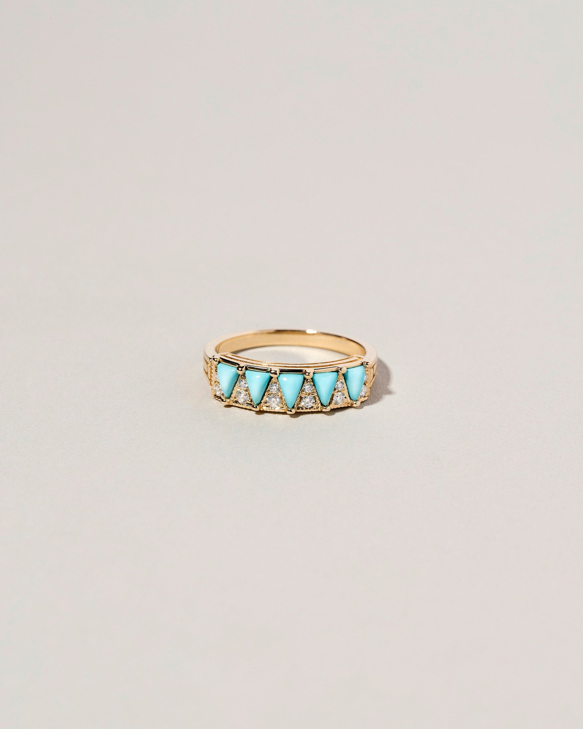 Five Triangle Ring - Turquoise on light color background.