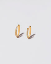 Tiny Loop Hoops on light colored background.