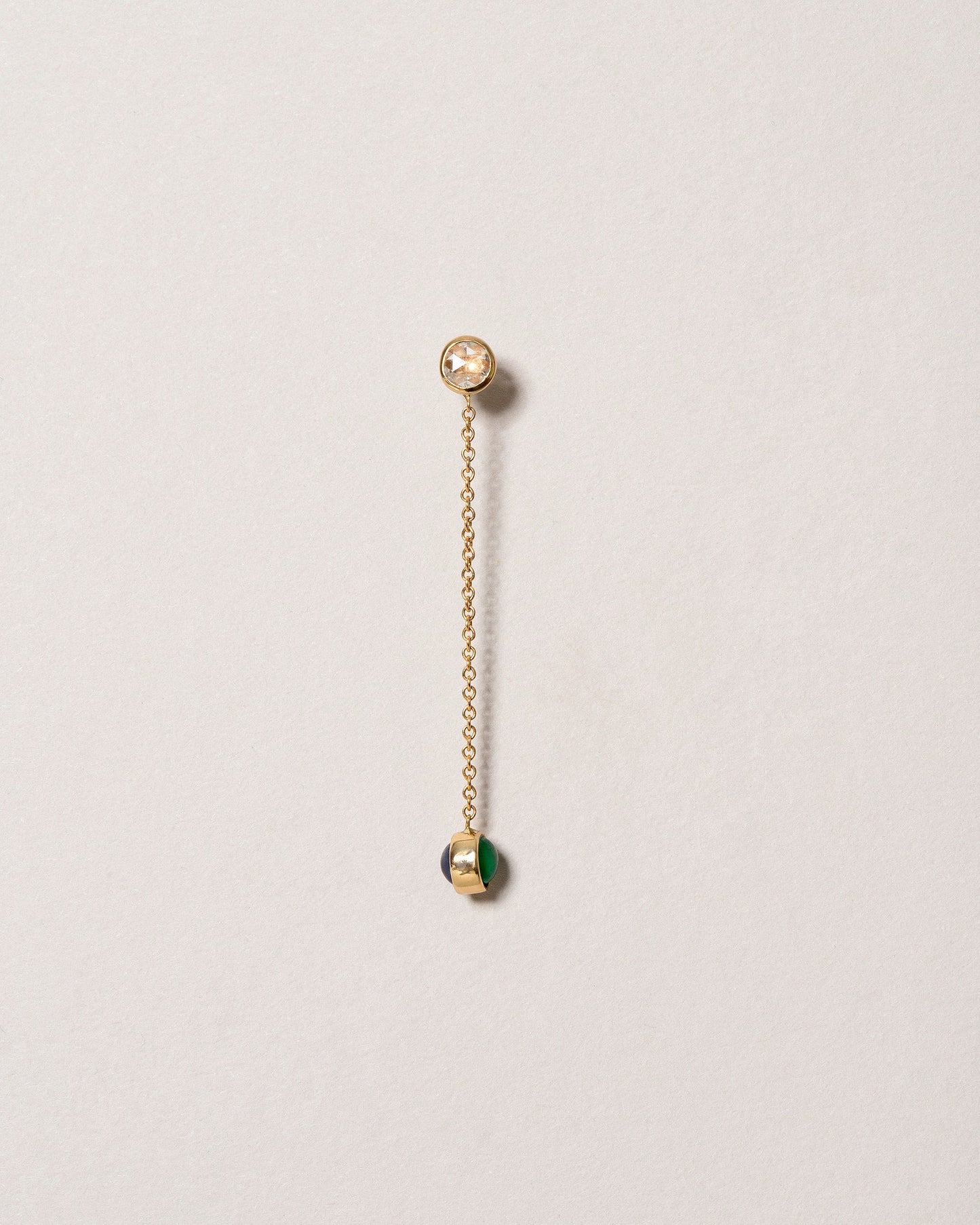 Birthstone One-Drop Single Earring on light color background.