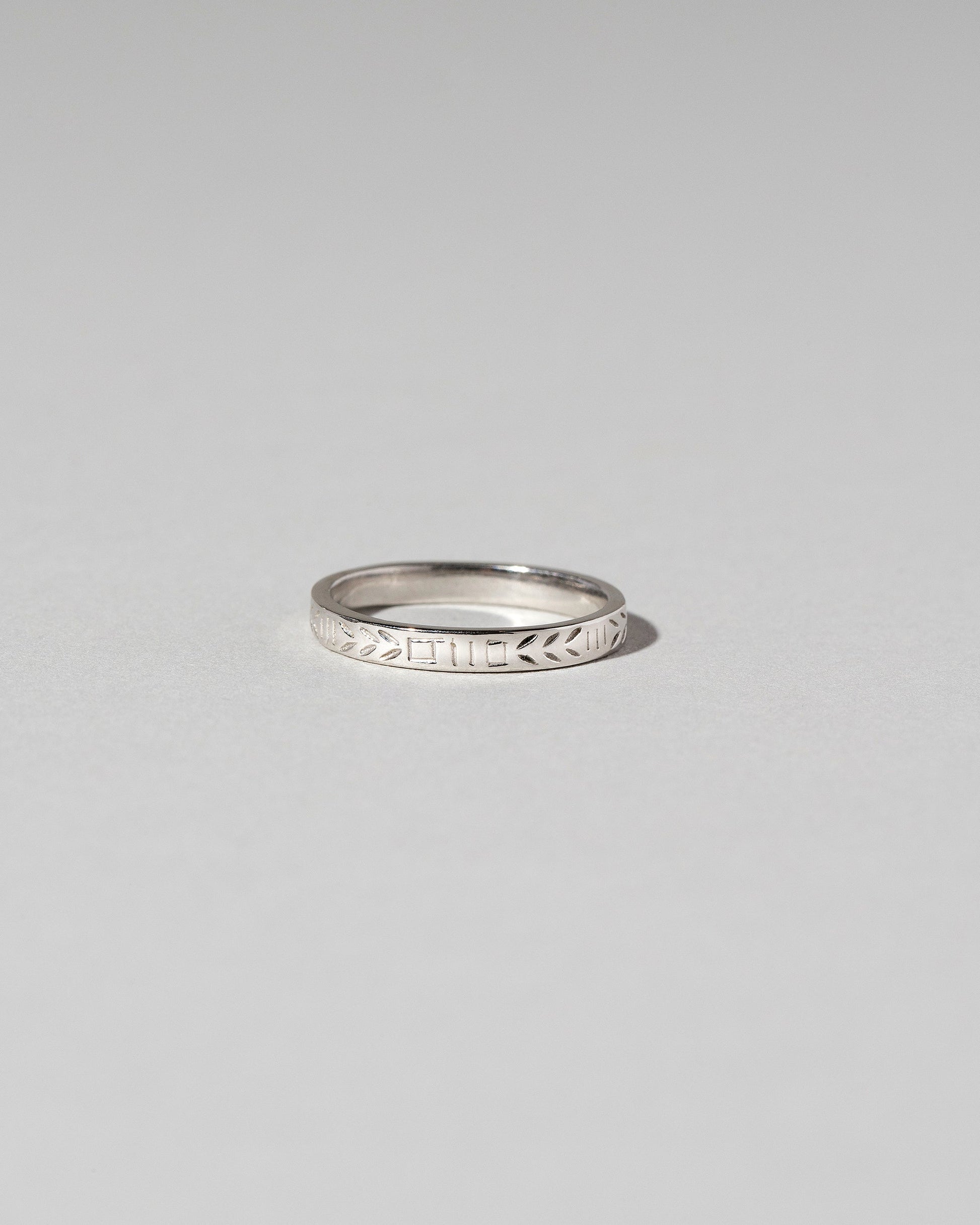 Platinum Etched Infinity Pattern Band on light color background.