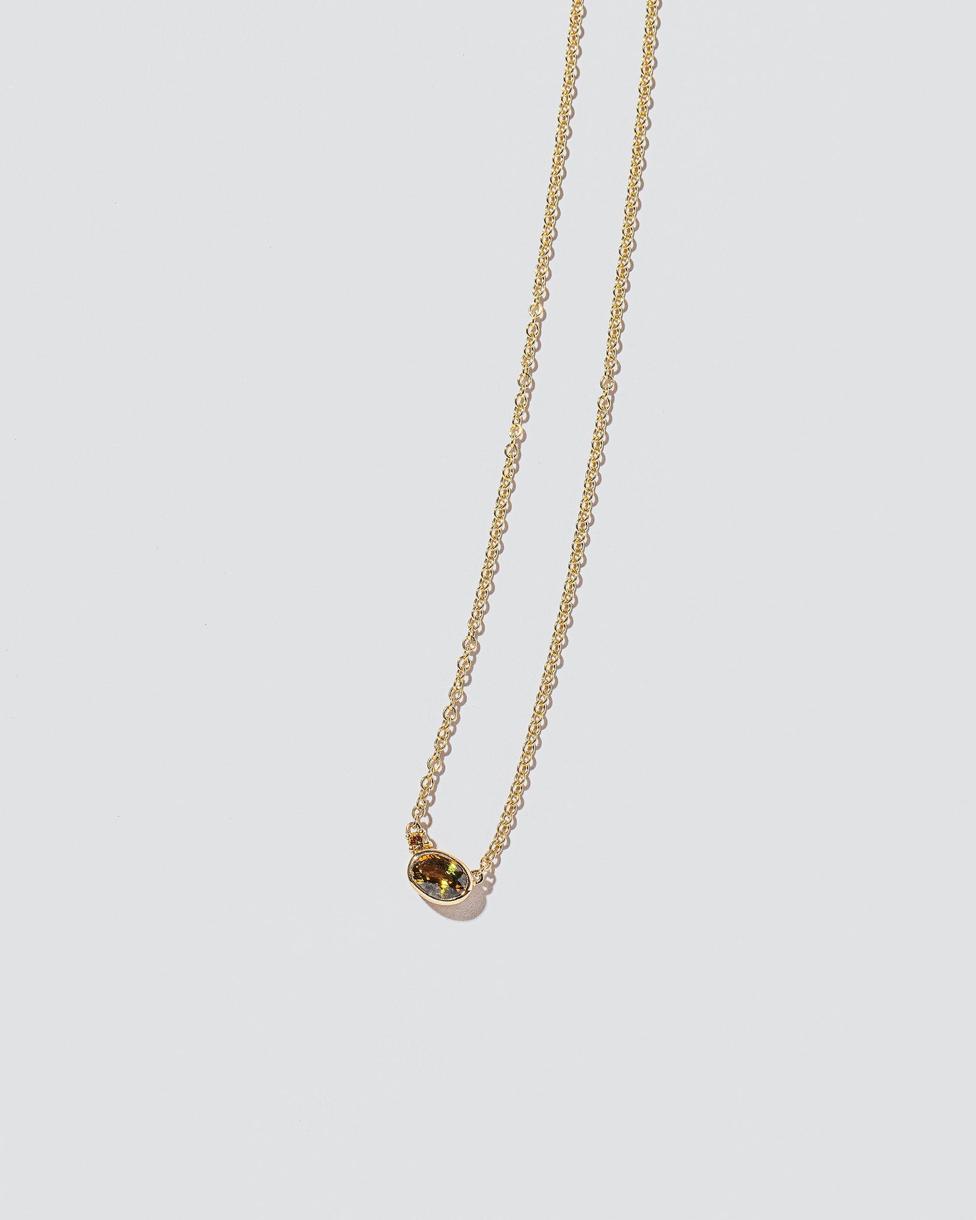 Stand Necklace on light color background.