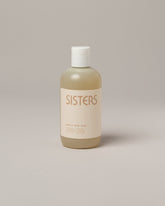 Sisters Body Gentle Body Wash on light color background.
