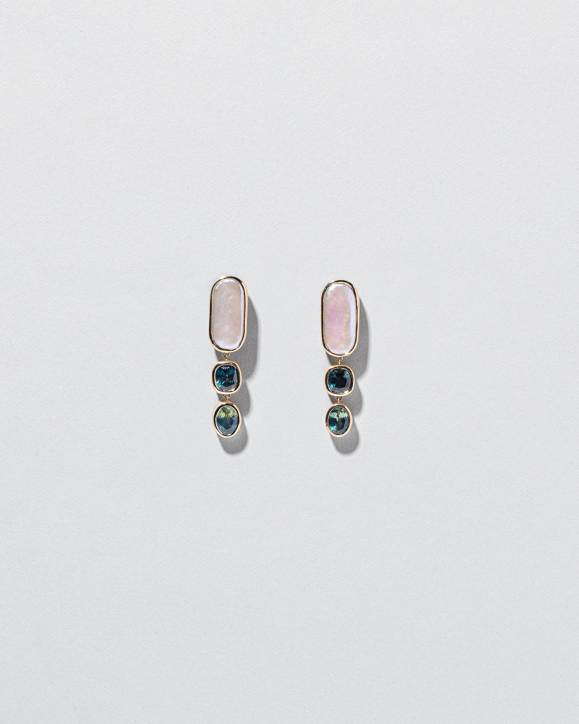Luster Earrings on light color background.